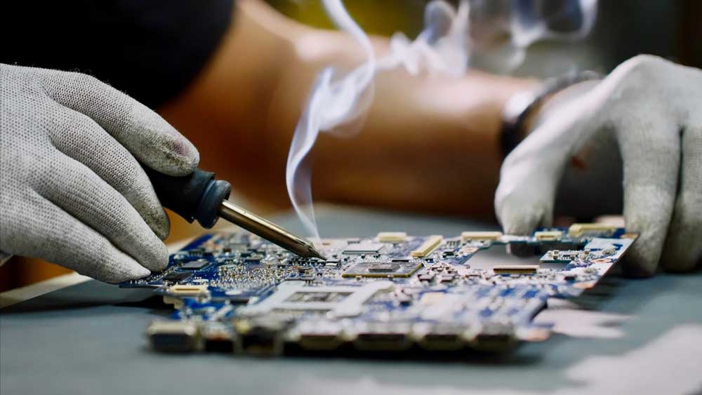 Engineer soldering on flexible PCB