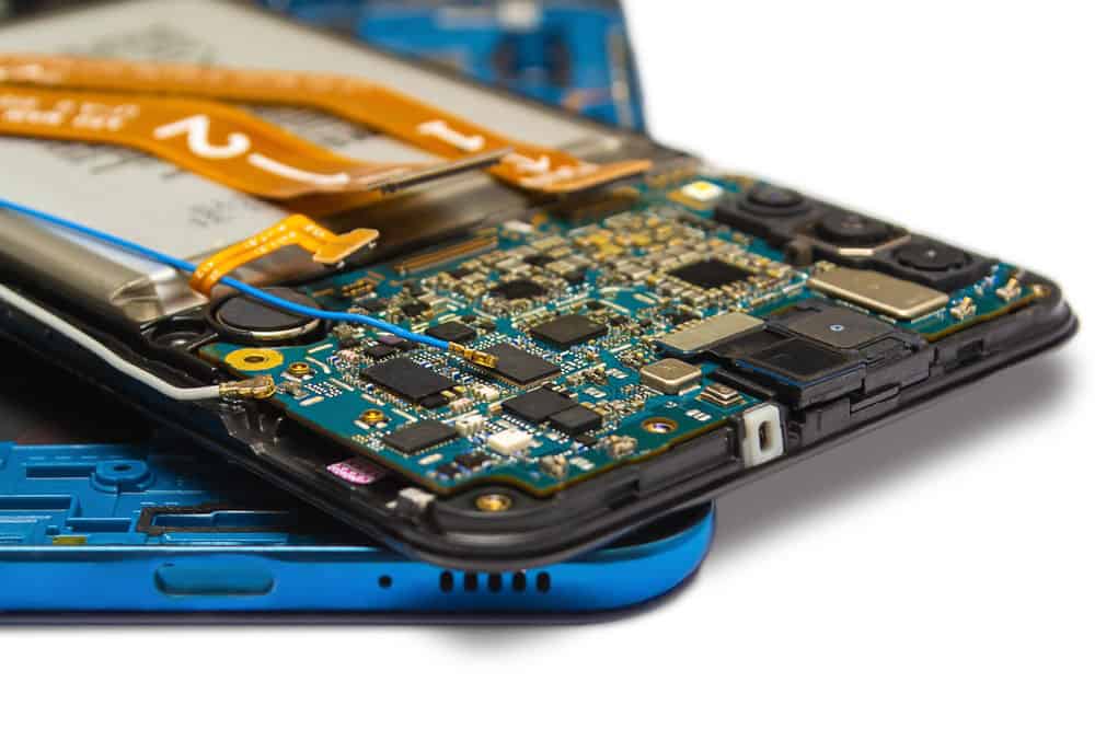 An open smartphone showing battery and PCB components
