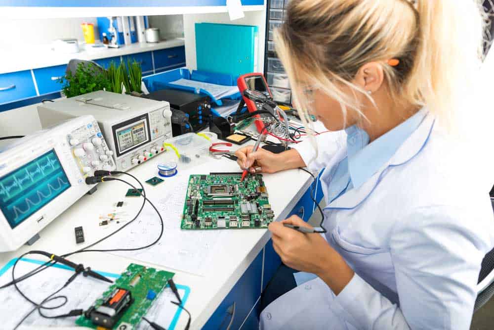 A female engineer working on a circuit board