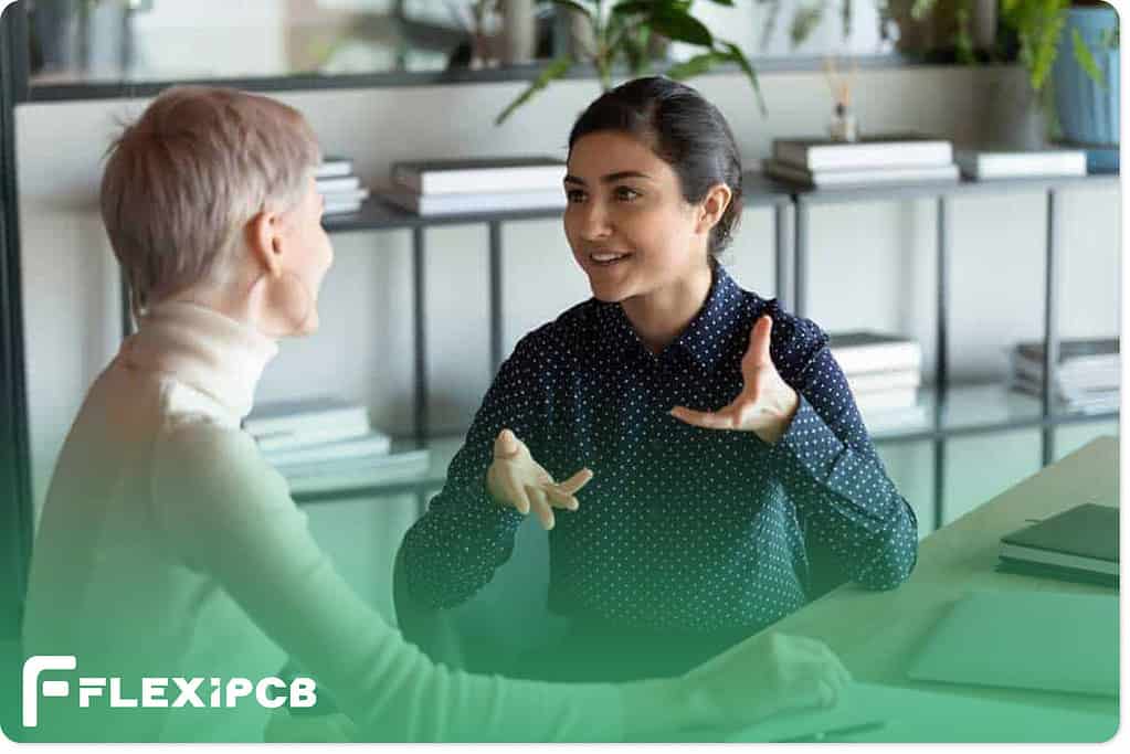 A saleswoman talking to a customer
